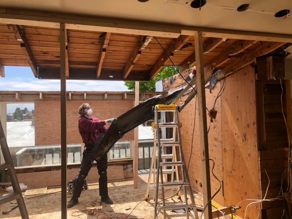 Man working on a partially built house